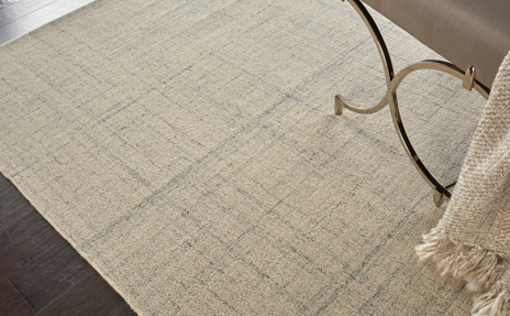 Nourison beige area rug with dark fade pattern 