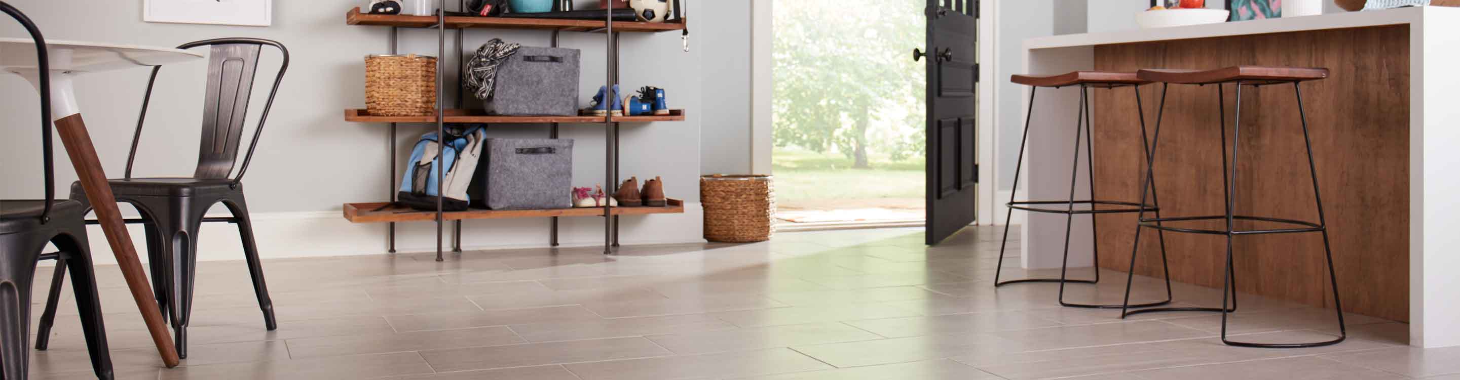 tile floors in kitchen with wood island and white countertops